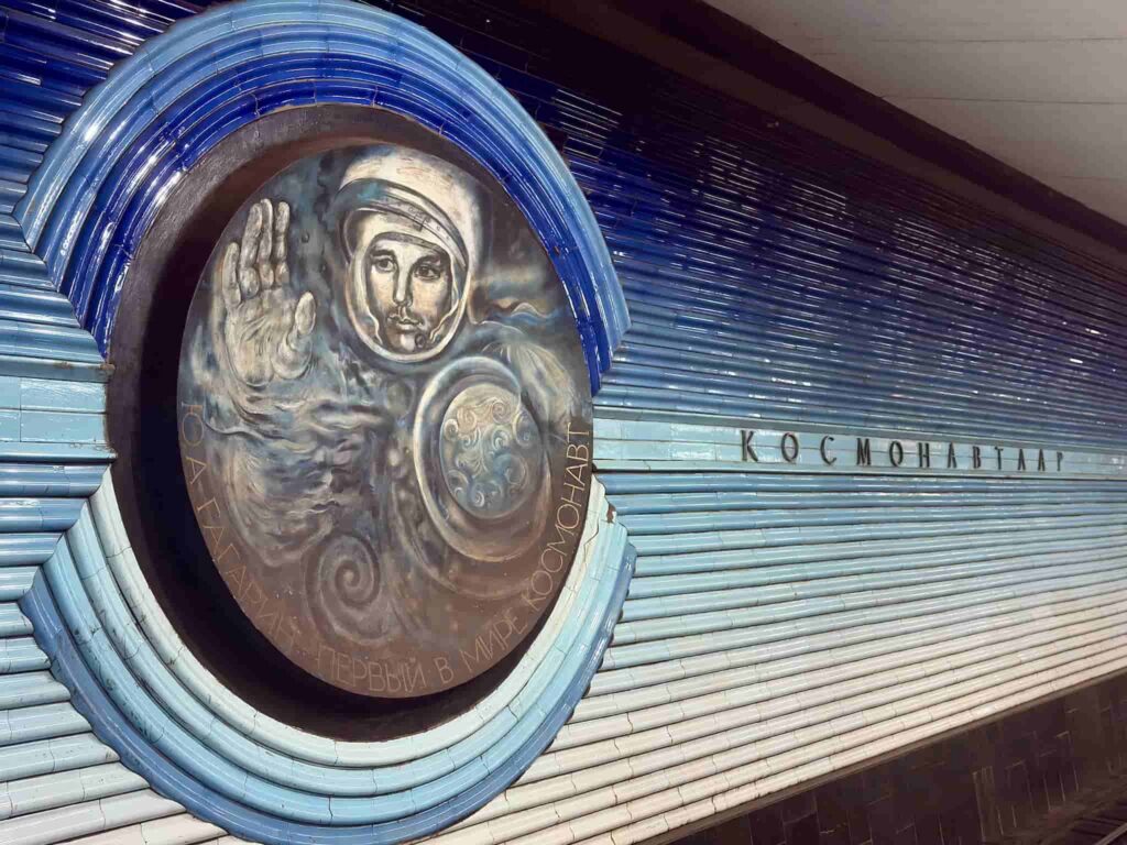 A futuristic wall painting of cosmonaut Yuri Gagarin at Kosmonavtlar metro station, a top highlight in this Tashkent travel guide.