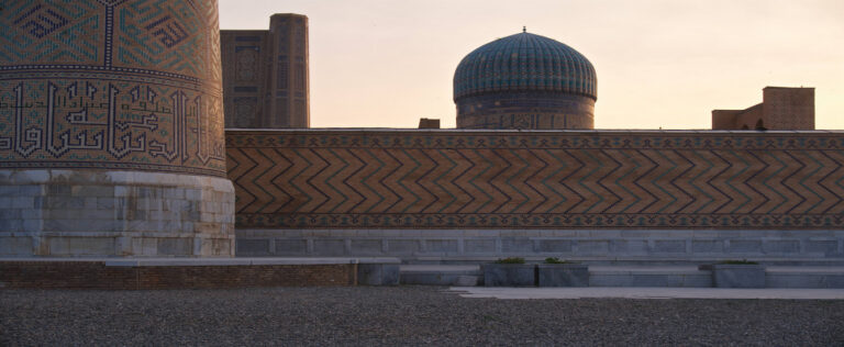 close-up shot of the tile exterior design of a mausoleum in many shades of blue in Samarkand, Uzbekistan