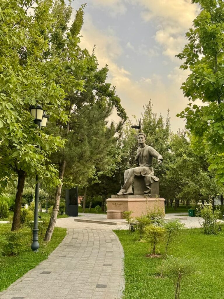 green park in Tashkent with statue of Amir Temur sitting down