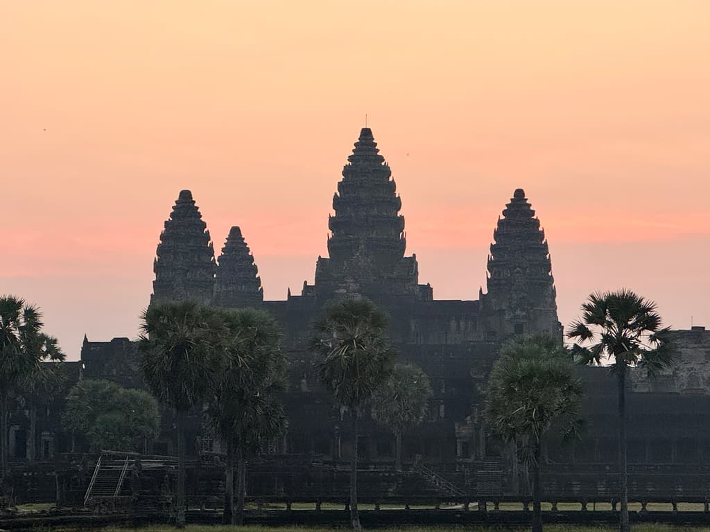 Stunning sunrise behind the main towers of Angkor Wat temple in Siem Reap, Cambodia.