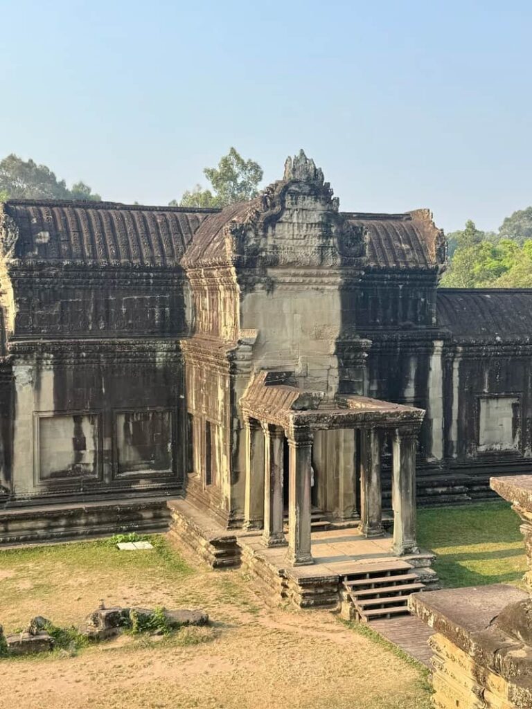 Intricate Khmer architecture and stone doorway at the main Angkor Wat temple in Cambodia