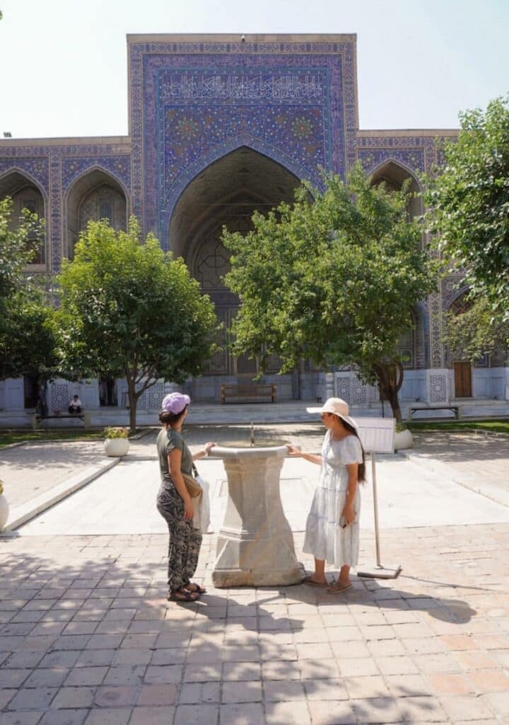 the author of this blog and the tour guide in Samarkand showing us the beautiful monuments of this city